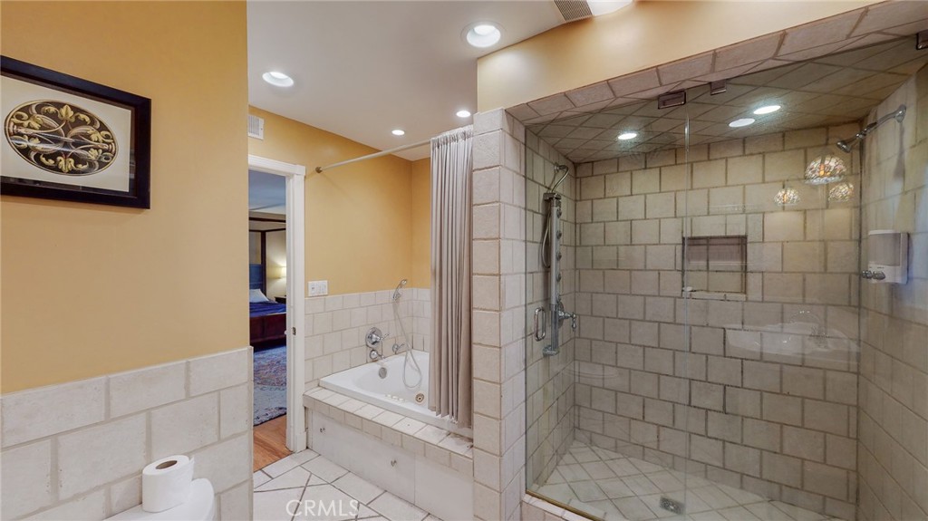 1248 Rocky Road Simi Valley, CA 93063 - Photo 22 of 71 a bathroom with a bathtub and a shower