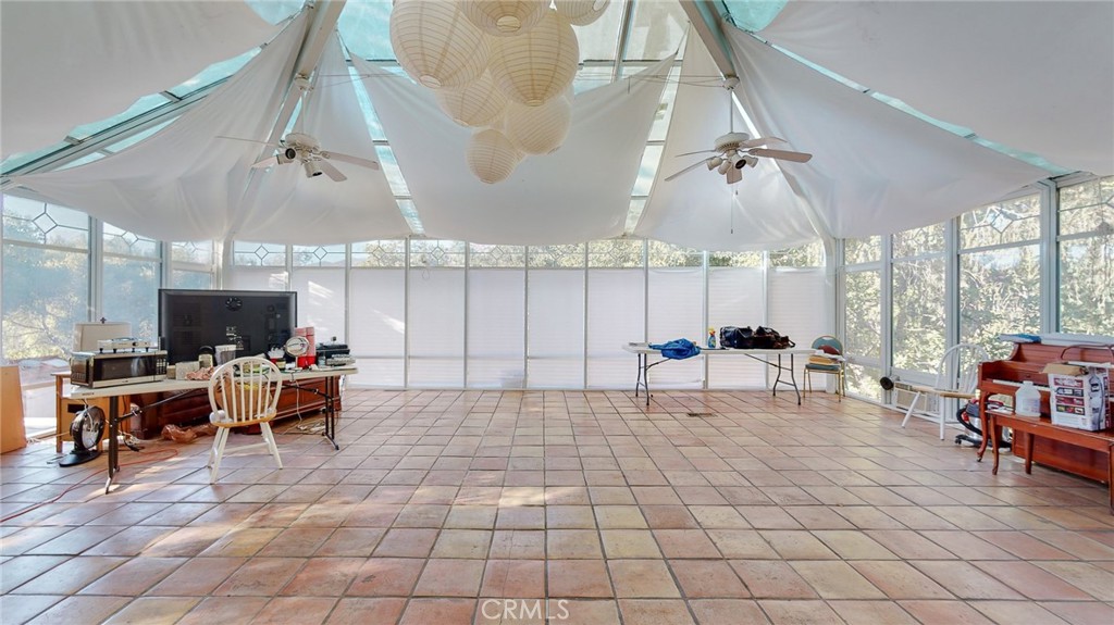 1248 Rocky Road Simi Valley, CA 93063 - Photo 33 of 55 a living room with lots of furniture and a flat screen tv