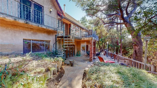 a view of a yard with large trees