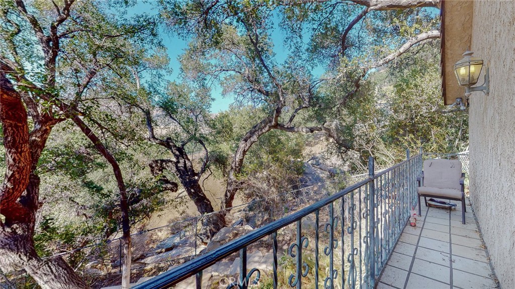 1248 Rocky Road Simi Valley, CA 93063 - Photo 42 of 71 a balcony with wooden fence and trees