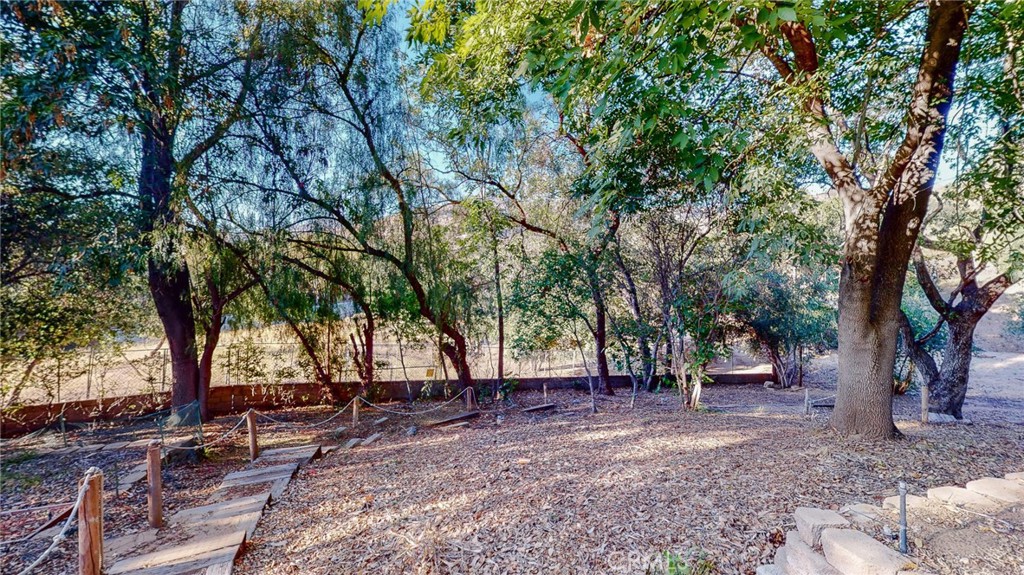 1248 Rocky Road Simi Valley, CA 93063 - Photo 43 of 71 a view of a backyard with large trees