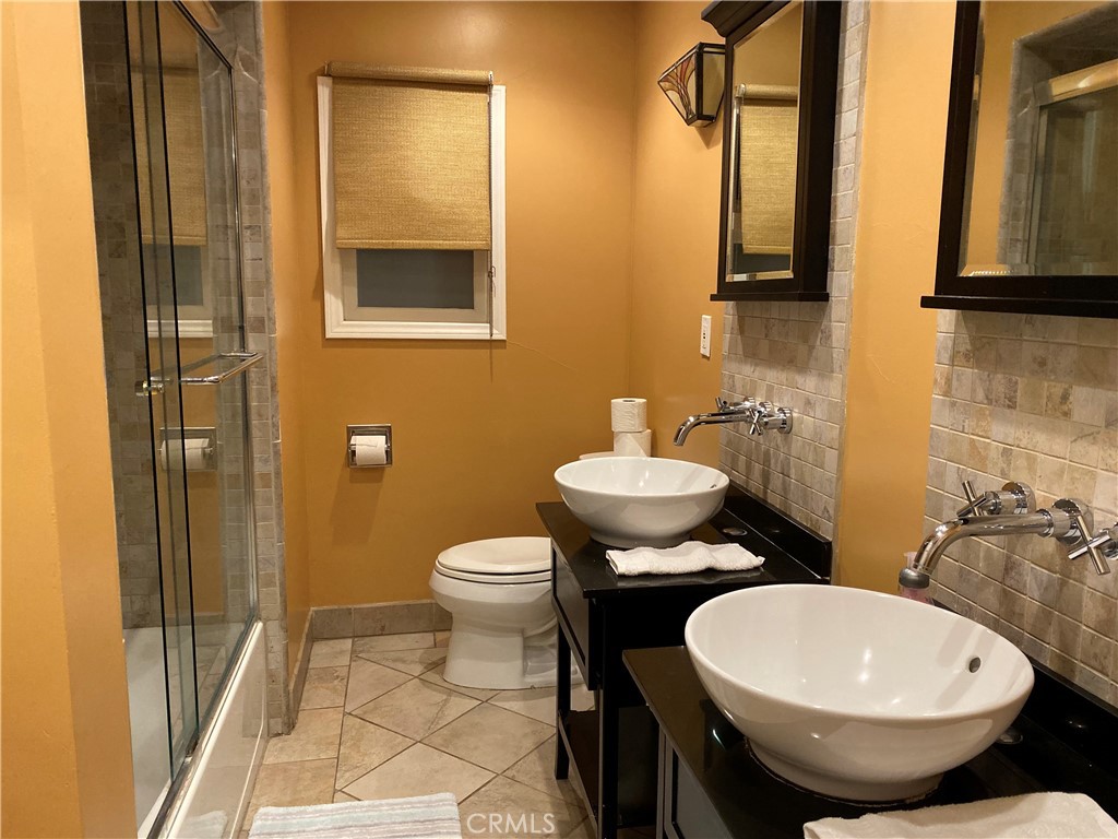 1248 Rocky Road Simi Valley, CA 93063 - Photo 46 of 71 a bathroom with a toilet sink and mirror