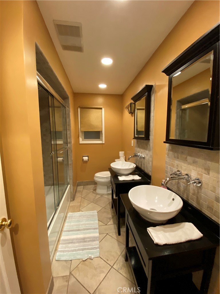 1248 Rocky Road Simi Valley, CA 93063 - Photo 47 of 71 a bathroom with a sink and a mirror
