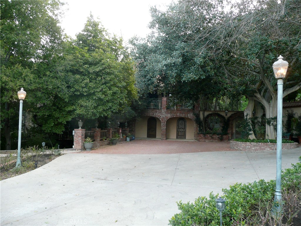 1248 Rocky Road Simi Valley, CA 93063 - Photo 59 of 71 a front view of a house with a yard and potted plants