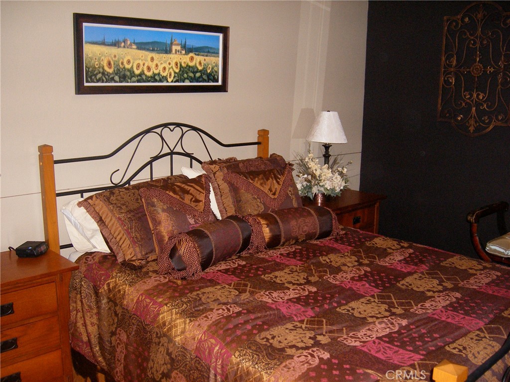 1248 Rocky Road Simi Valley, CA 93063 - Photo 67 of 71 a bed sitting in a bedroom next to a lamp