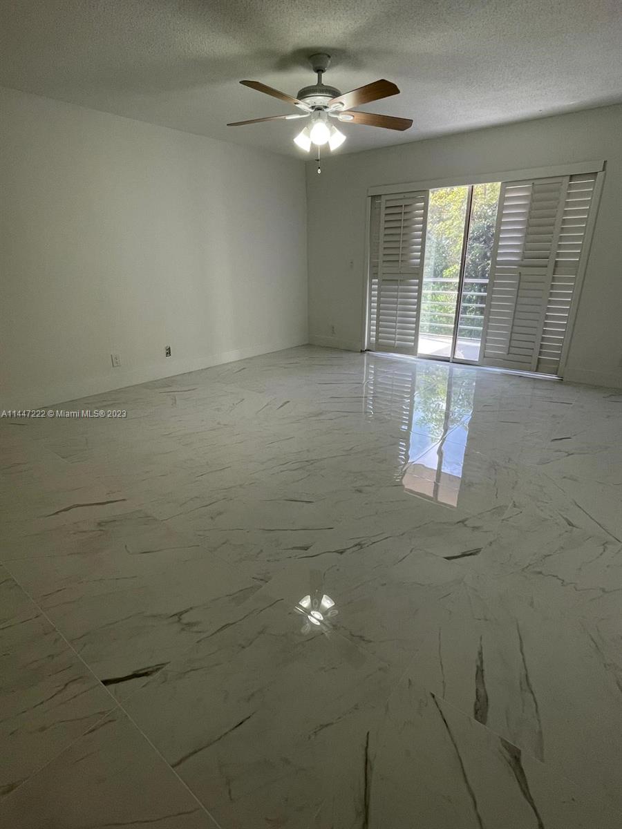 5790 Stirling Road, Unit 205 Hollywood, FL 33021 - Photo 10 of 28 a view of an empty room with a window