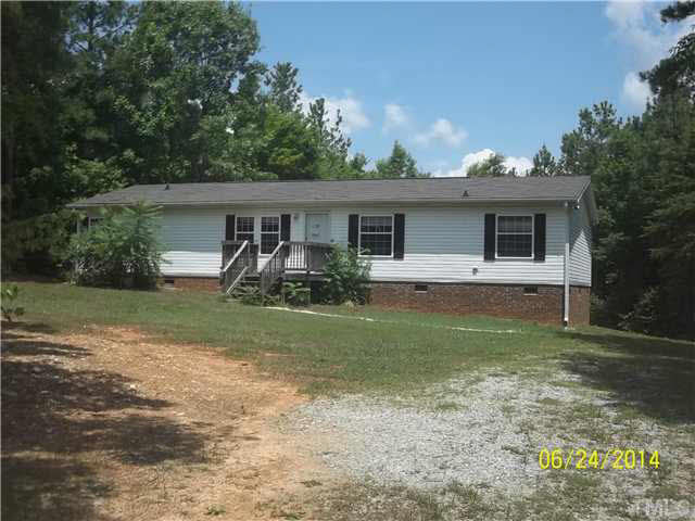 3457 Bowmantown Road, Unit 1 Roxboro, NC 27574 - Photo 1 of 3 a front view of house with yard and green space