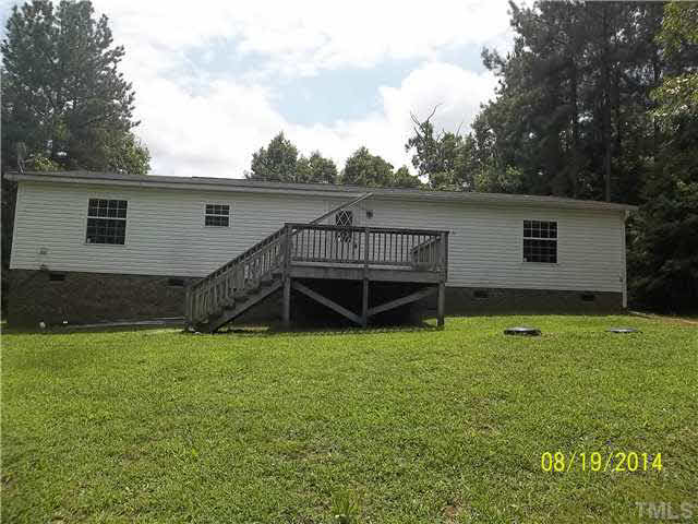 3457 Bowmantown Road, Unit 1 Roxboro, NC 27574 - Photo 2 of 3 a view of a house with a backyard
