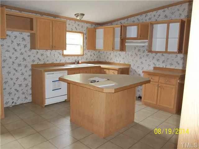 3457 Bowmantown Road, Unit 1 Roxboro, NC 27574 - Photo 3 of 3 a view of a kitchen with cabinets