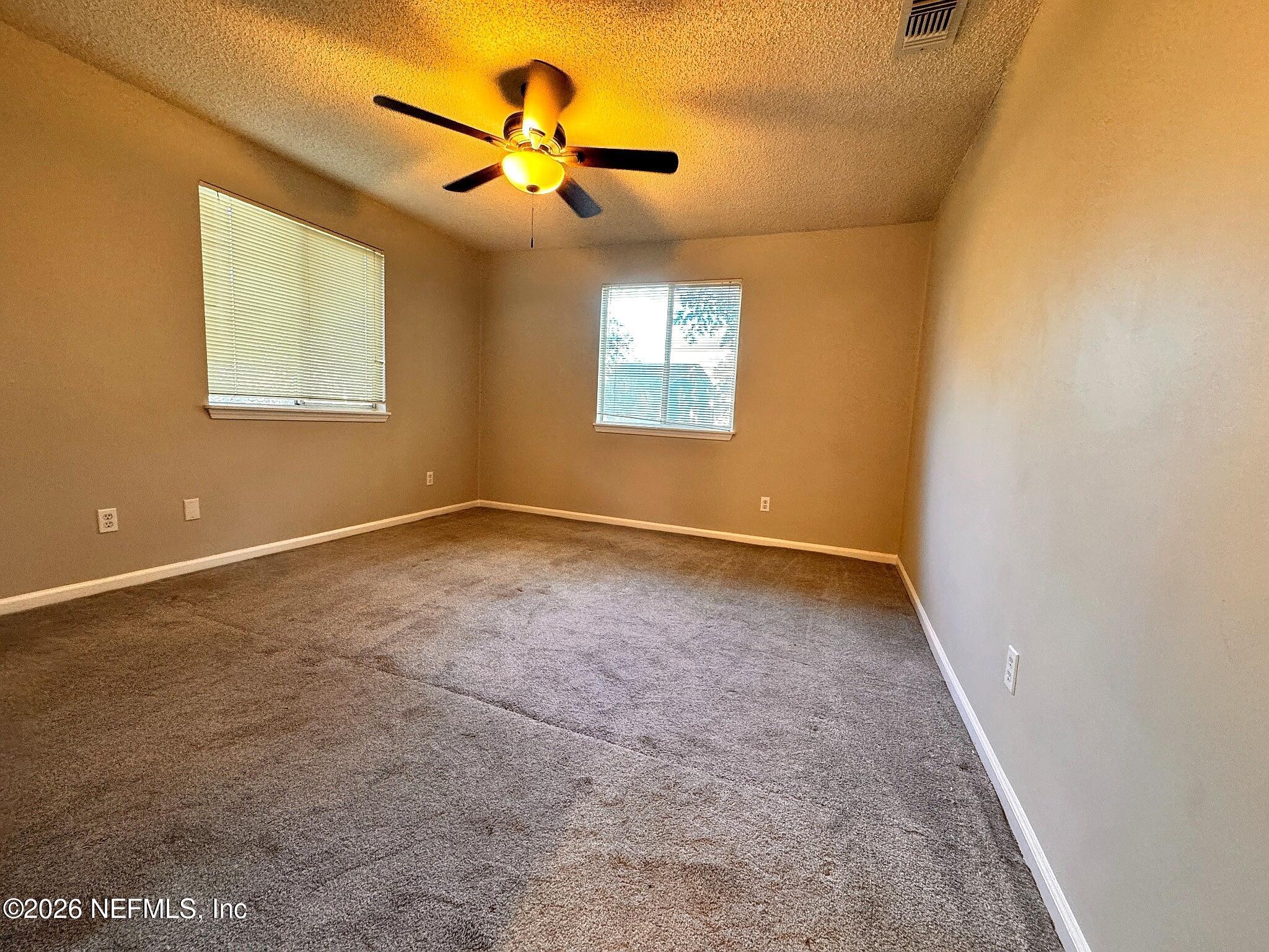 3270 Ricky Drive, Unit 302 Jacksonville, FL 32223 - Photo 6 of 12 05_Primary_Bedroom.jpg
