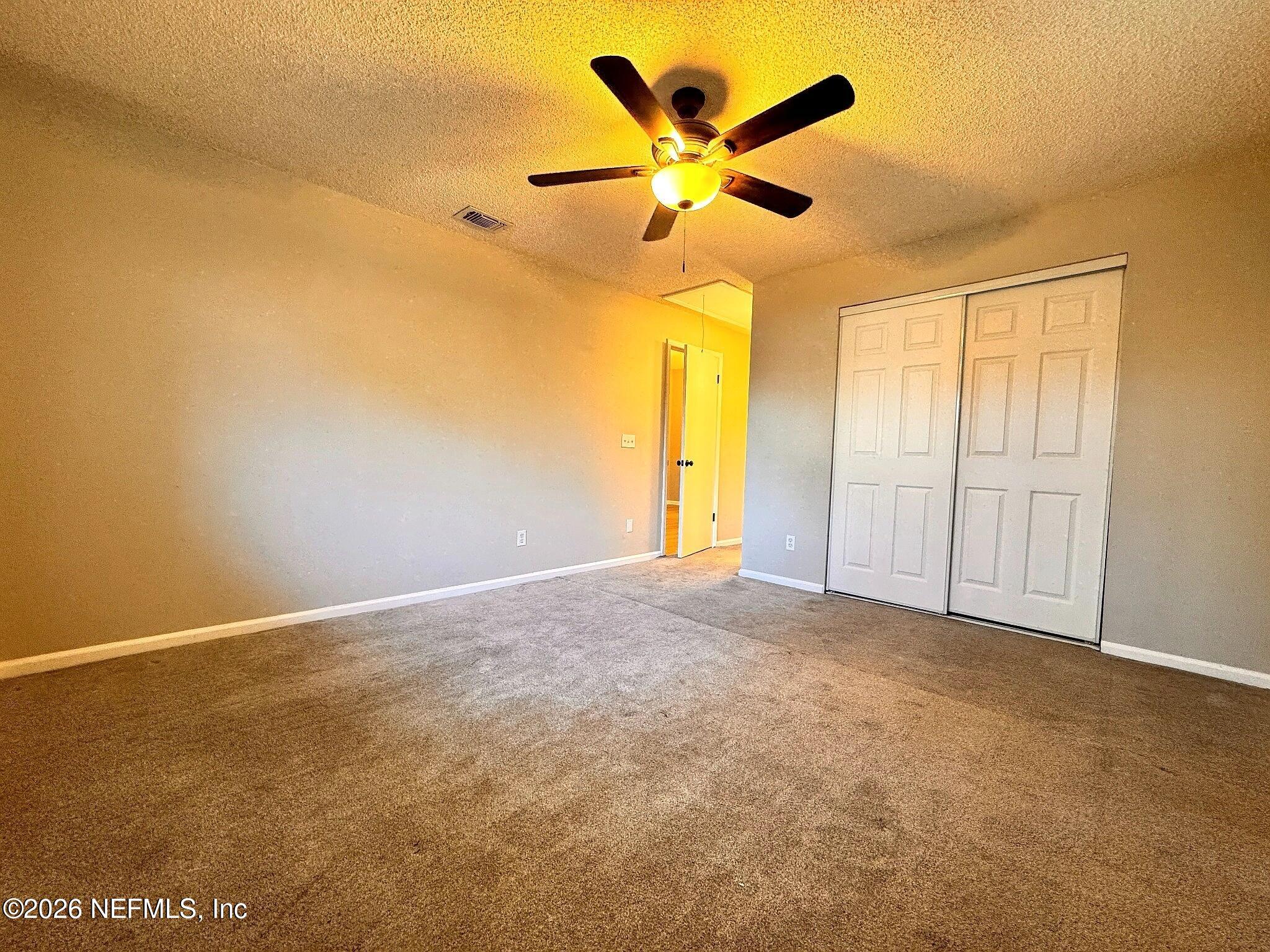 3270 Ricky Drive, Unit 302 Jacksonville, FL 32223 - Photo 7 of 12 06_Primary_Bedroom_Alt.jpg