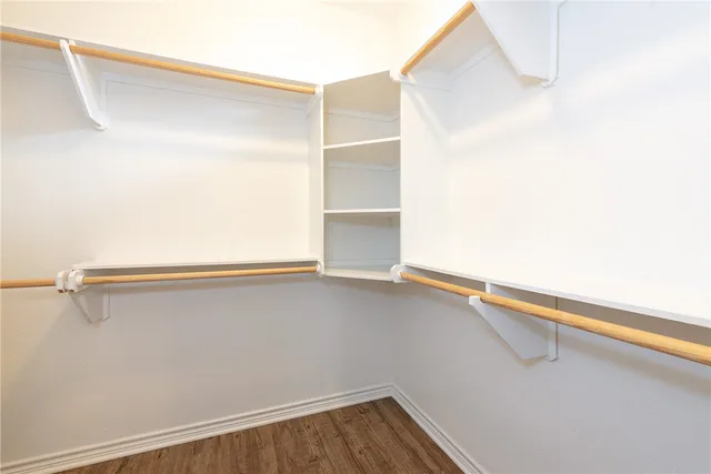 a view of an empty walk in closet