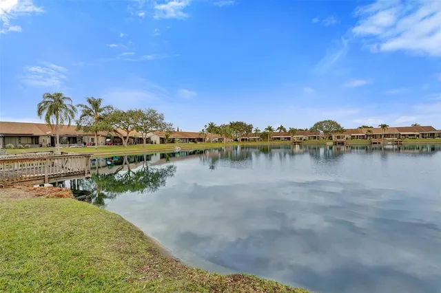 a view of a lake with houses in the back