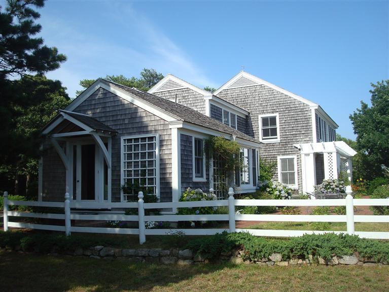 74 Sears Point Road Chatham, MA 02633 - Photo 11 of 16 a front view of a house with a yard