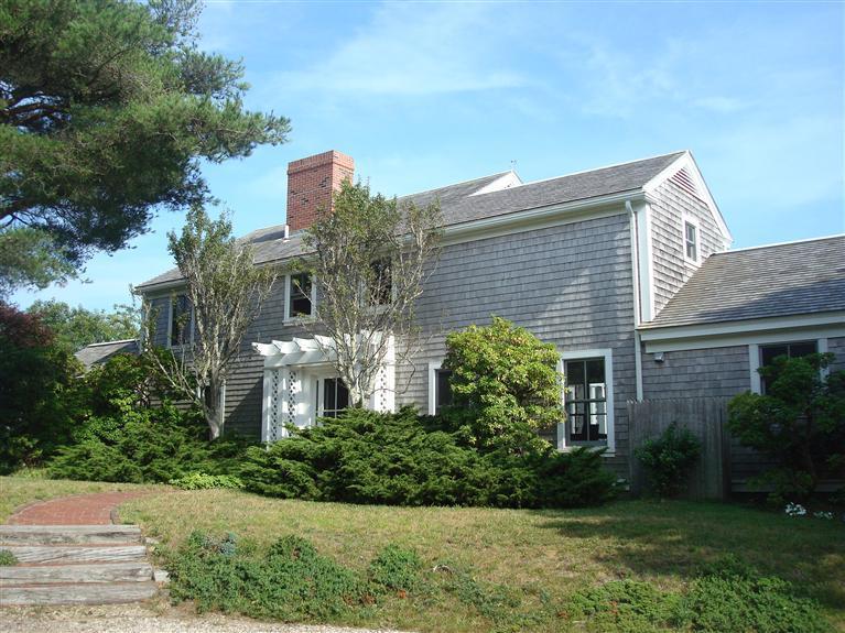 74 Sears Point Road Chatham, MA 02633 - Photo 10 of 16 a front view of a house with a yard