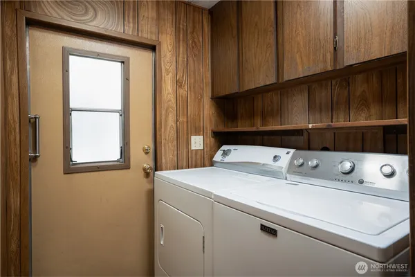 a utility room with dryer and washer