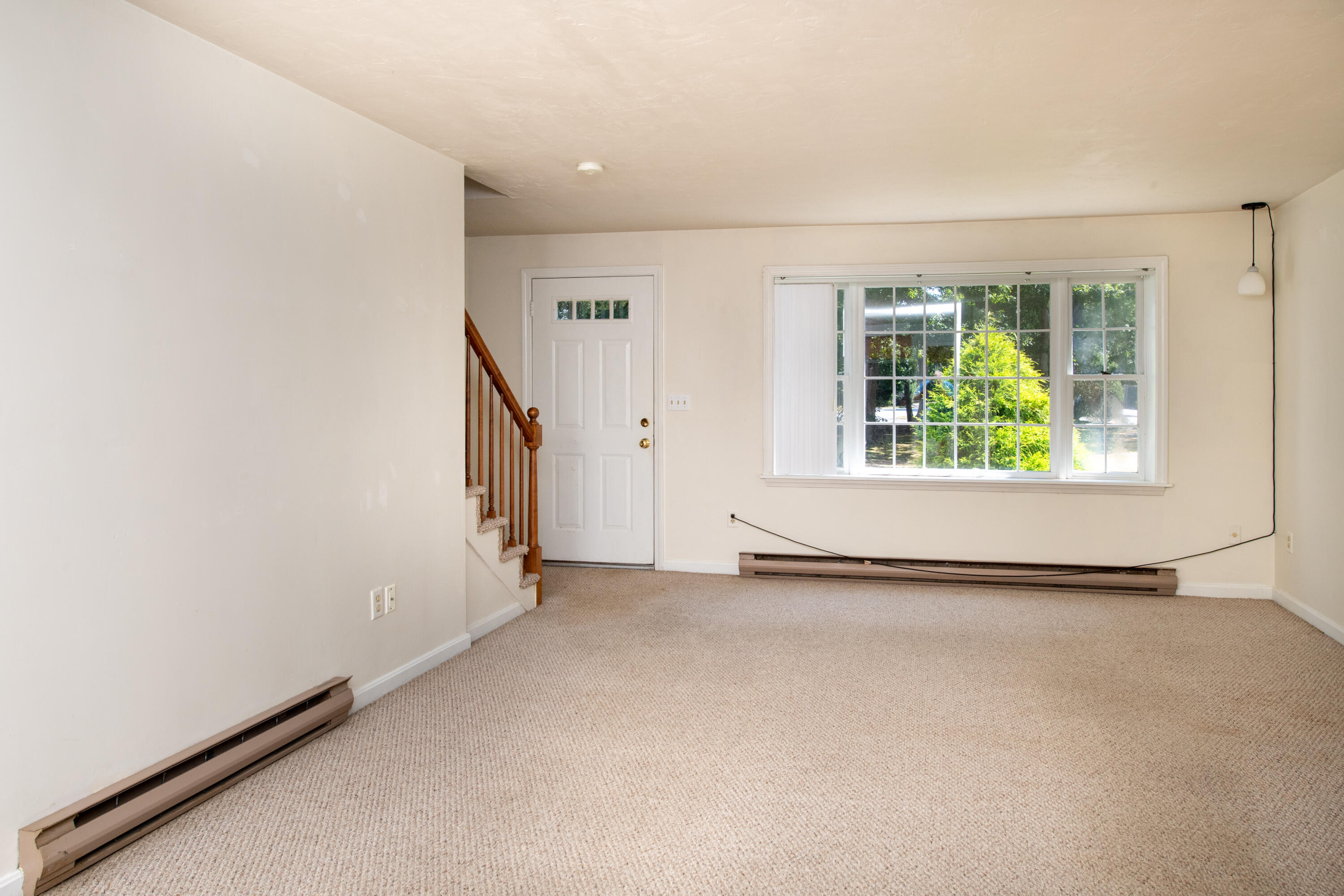 248 Camp Street, Unit M5 West Yarmouth, MA 02673 - Photo 5 of 12 an empty room with windows
