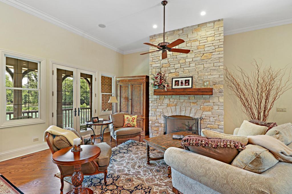 385 Spring Creek Road Barrington Hills, IL 60010 - Photo 11 of 53 a living room with furniture and a fireplace