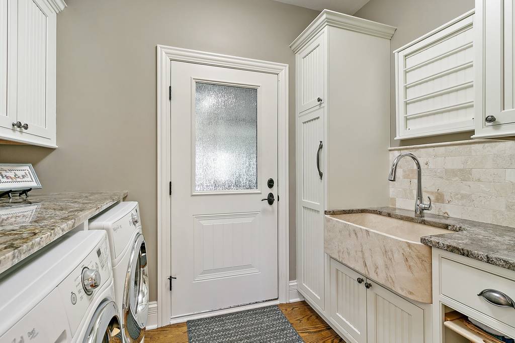 385 Spring Creek Road Barrington Hills, IL 60010 - Photo 23 of 53 a bathroom with a granite countertop sink and a mirror