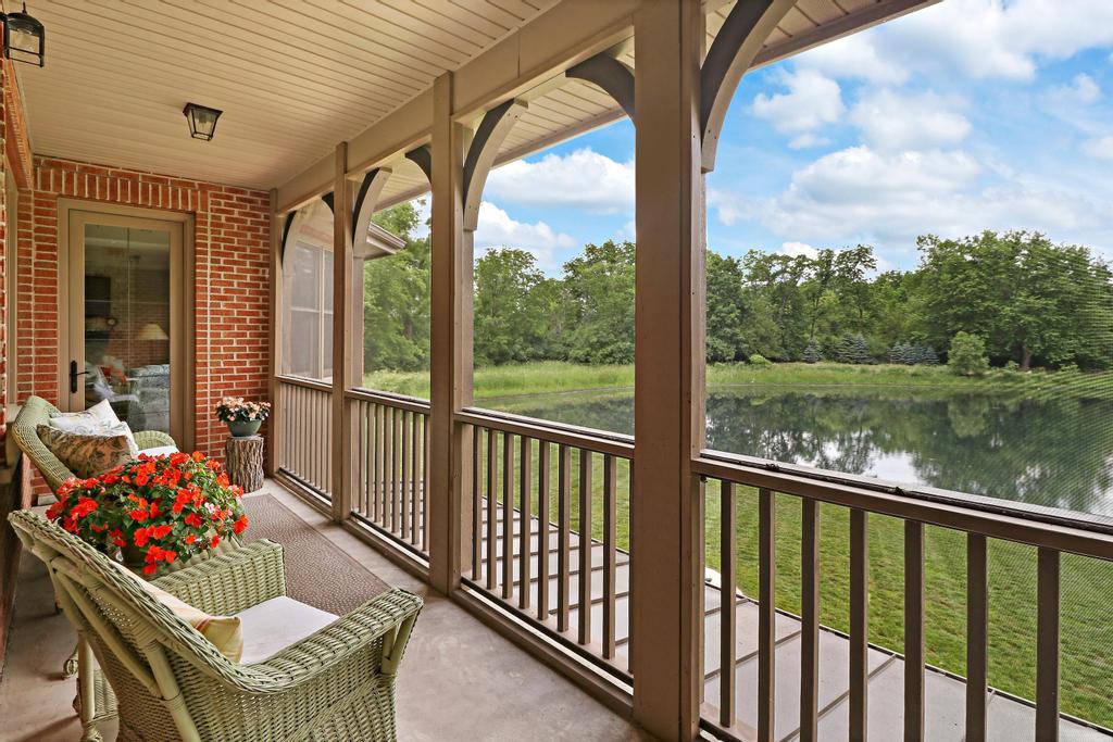 385 Spring Creek Road Barrington Hills, IL 60010 - Photo 25 of 53 a balcony with furniture and a lake view