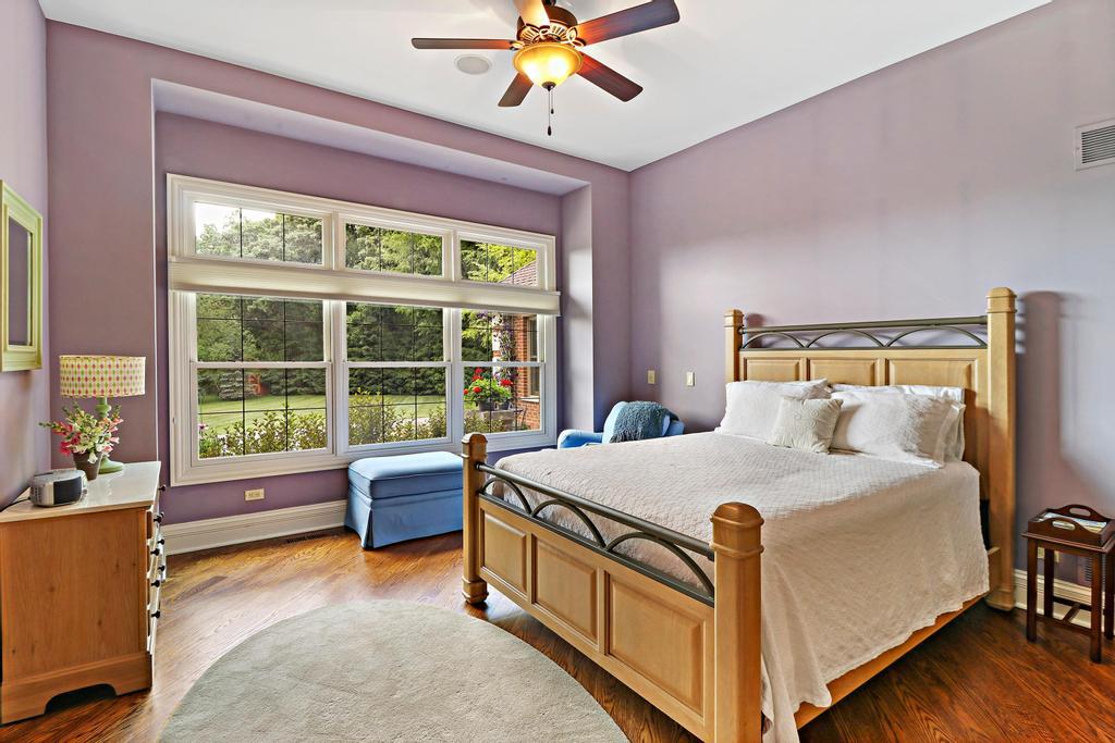385 Spring Creek Road Barrington Hills, IL 60010 - Photo 30 of 53 a bed room with a bed and a large window