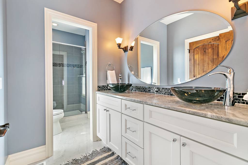 385 Spring Creek Road Barrington Hills, IL 60010 - Photo 32 of 53 a bathroom with a double vanity sink and a mirror