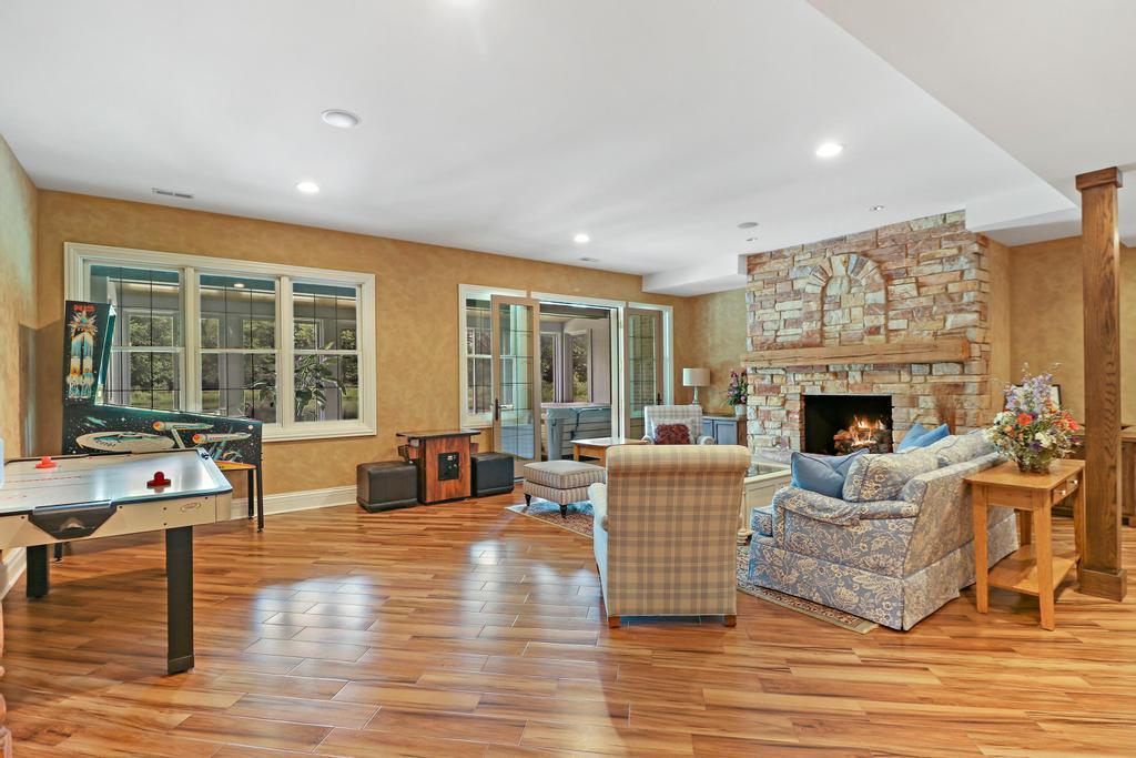 385 Spring Creek Road Barrington Hills, IL 60010 - Photo 35 of 53 a living room with furniture large window and flat screen tv