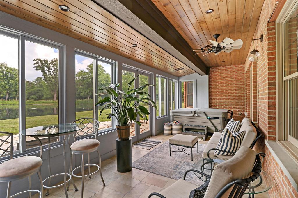 385 Spring Creek Road Barrington Hills, IL 60010 - Photo 47 of 53 a living room with furniture and a large window