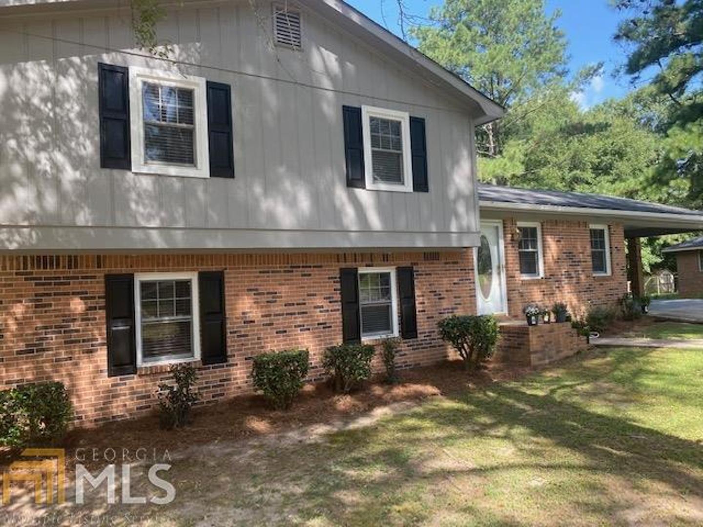 1861 Granade Road Southwest Conyers, GA 30094 - Photo 1 of 1 a front view of house with yard