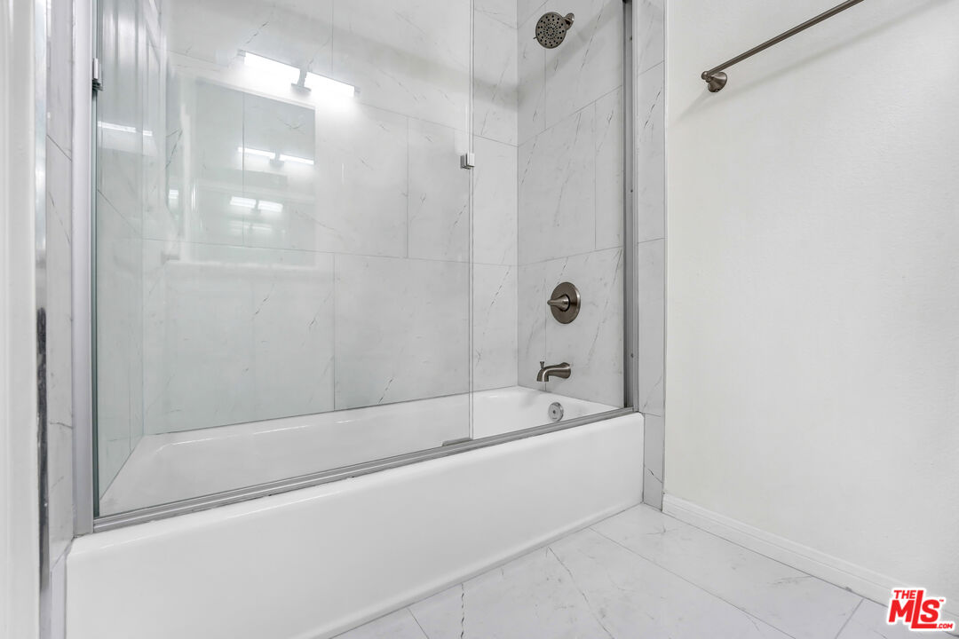 5430 Bellingham Avenue, Unit 306 Valley Village, CA 91607 - Photo 16 of 23 a bathroom with a bathtub and shower