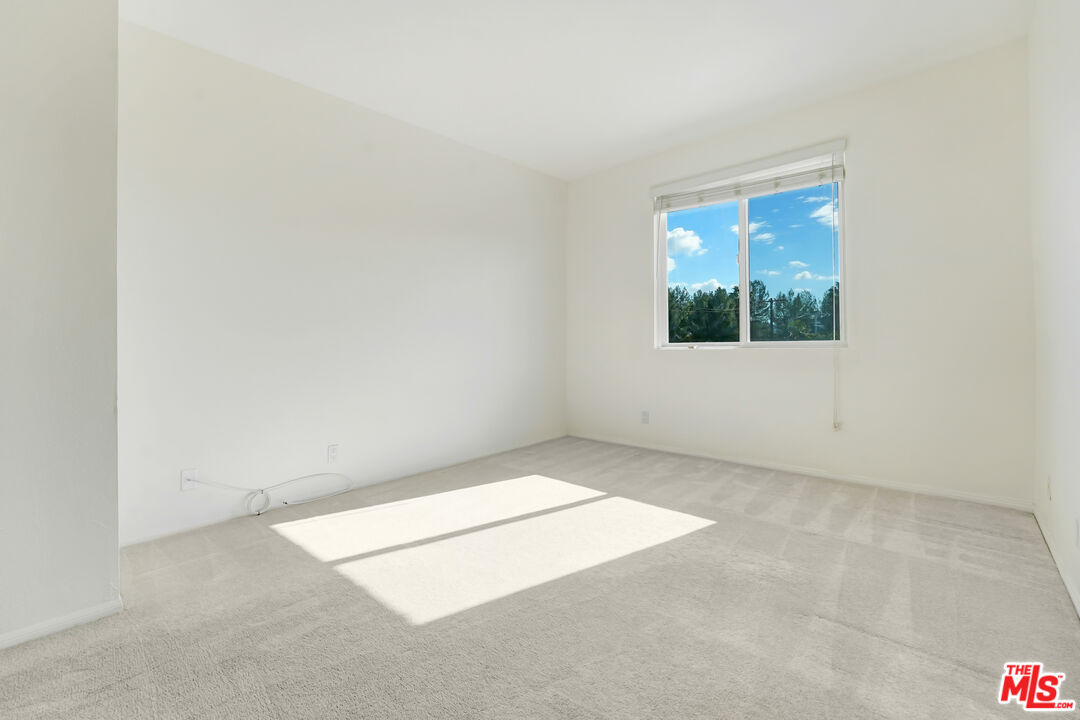 5430 Bellingham Avenue, Unit 306 Valley Village, CA 91607 - Photo 9 of 23 an empty room with windows