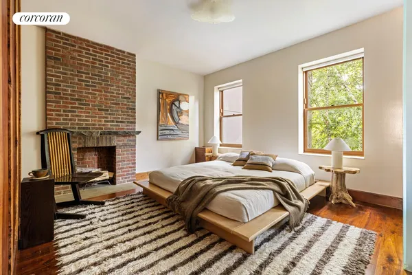 a kitchen with stainless steel appliances a kitchen island hardwood floor sink stove dining table and chairs