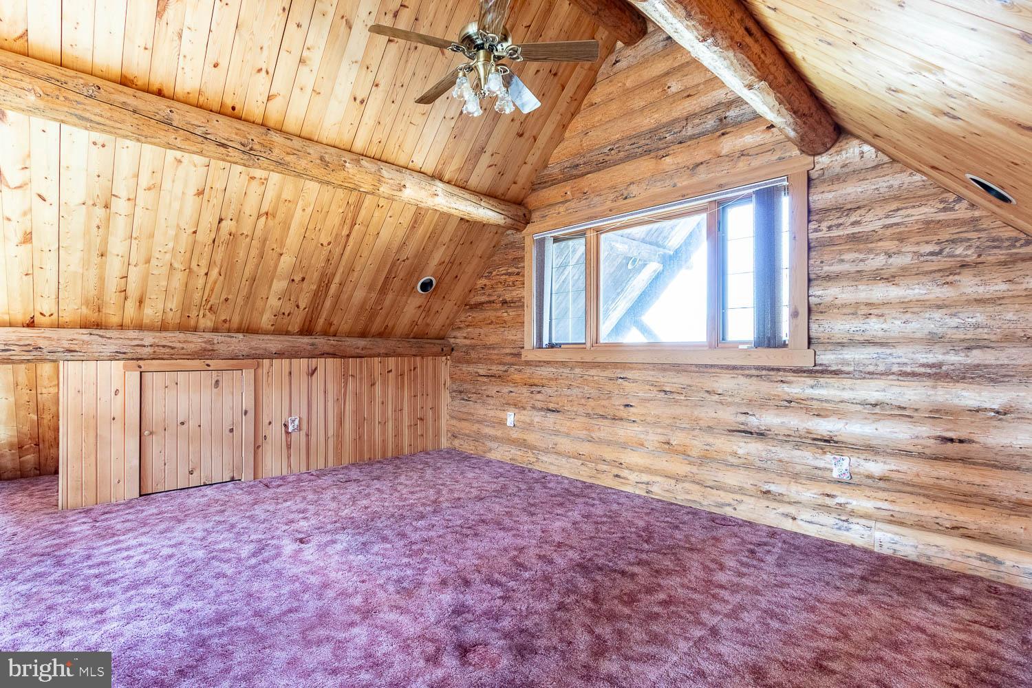 7869 Drane Highway West Decatur, PA 16878 - Photo 23 of 66 a view of a room with a window and wooden walls