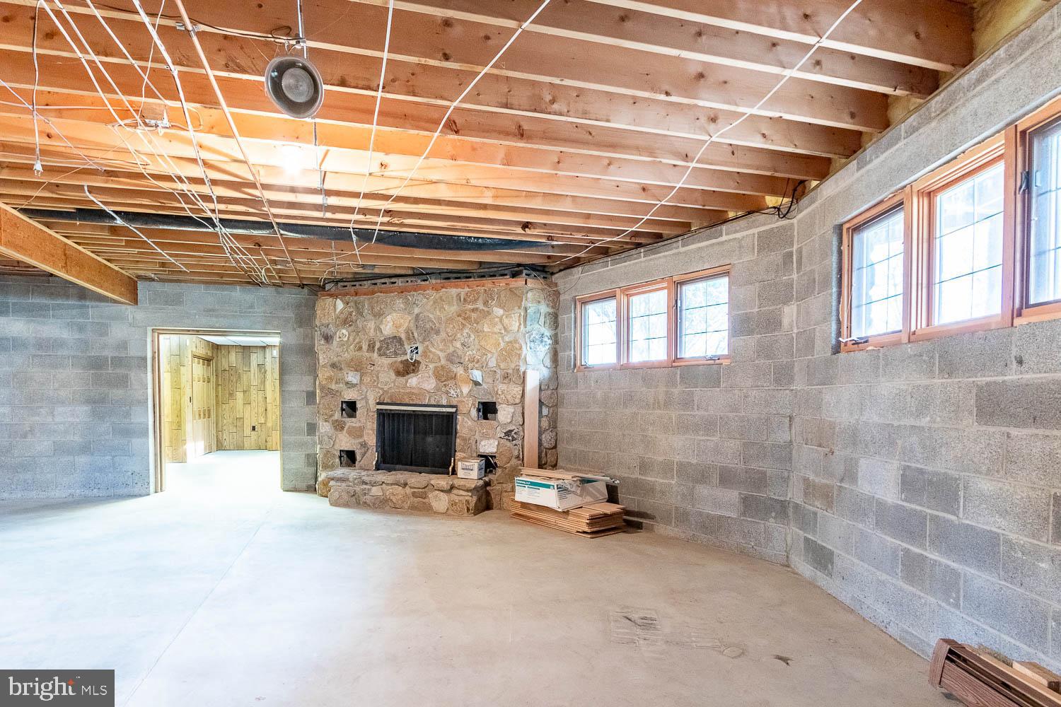 7869 Drane Highway West Decatur, PA 16878 - Photo 30 of 66 a view of a room with wooden floor and a fireplace