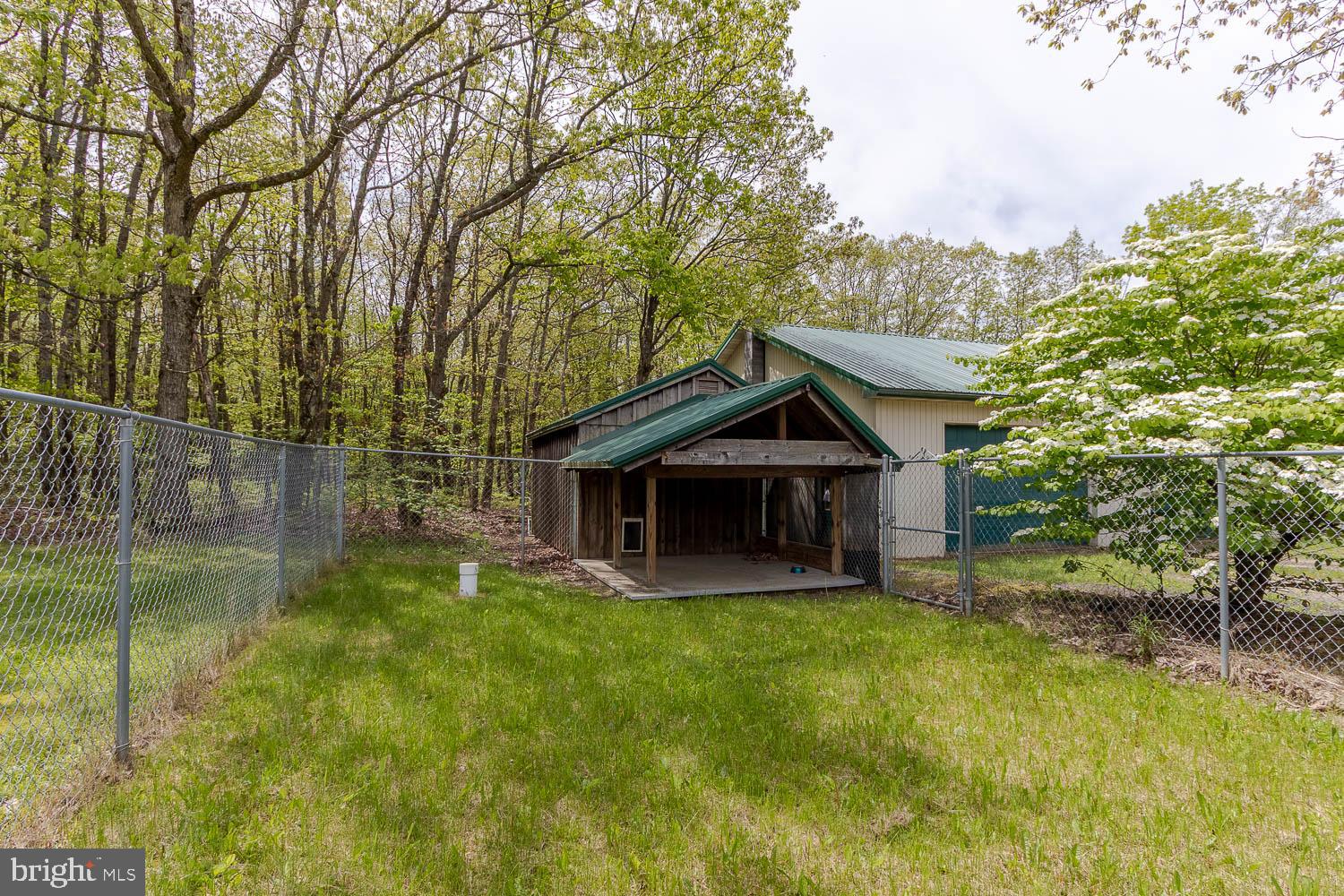 7869 Drane Highway West Decatur, PA 16878 - Photo 55 of 66 a view of a house with a yard and large trees