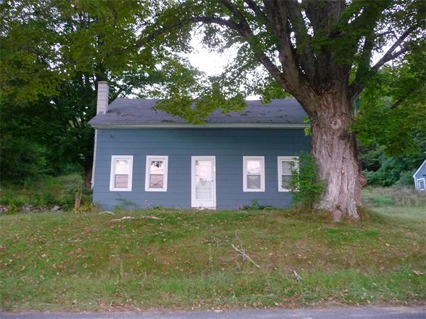 38 Greenwich Plains Road Ware, MA 01082 - Photo 1 of 21 a brick house with trees in front of it