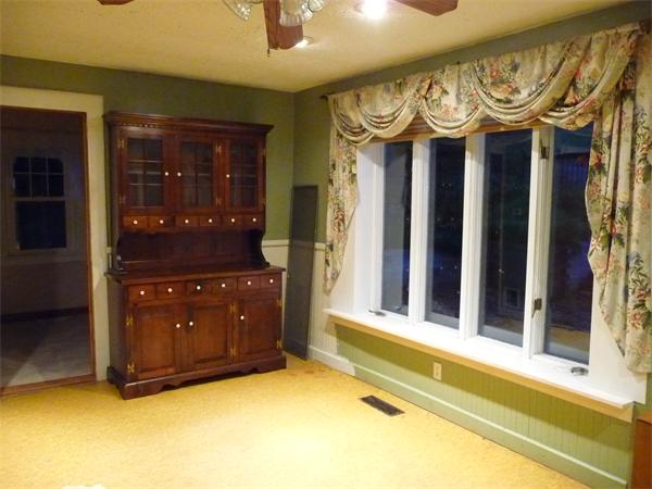 38 Greenwich Plains Road Ware, MA 01082 - Photo 8 of 21 a view of a hallway with a large mirror and a fan