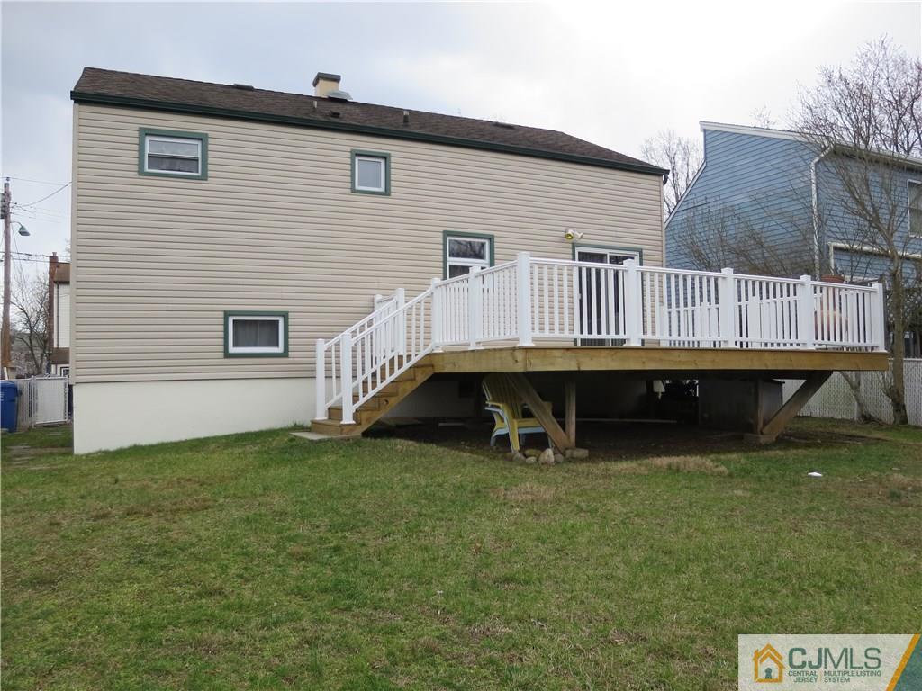 209 North Hill Road Colonia, NJ 07067 - Photo 2 of 18 a view of a house with a backyard