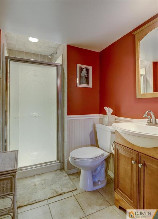 209 North Hill Road Colonia, NJ 07067 - Photo 12 of 18 a bathroom with a toilet sink and shower