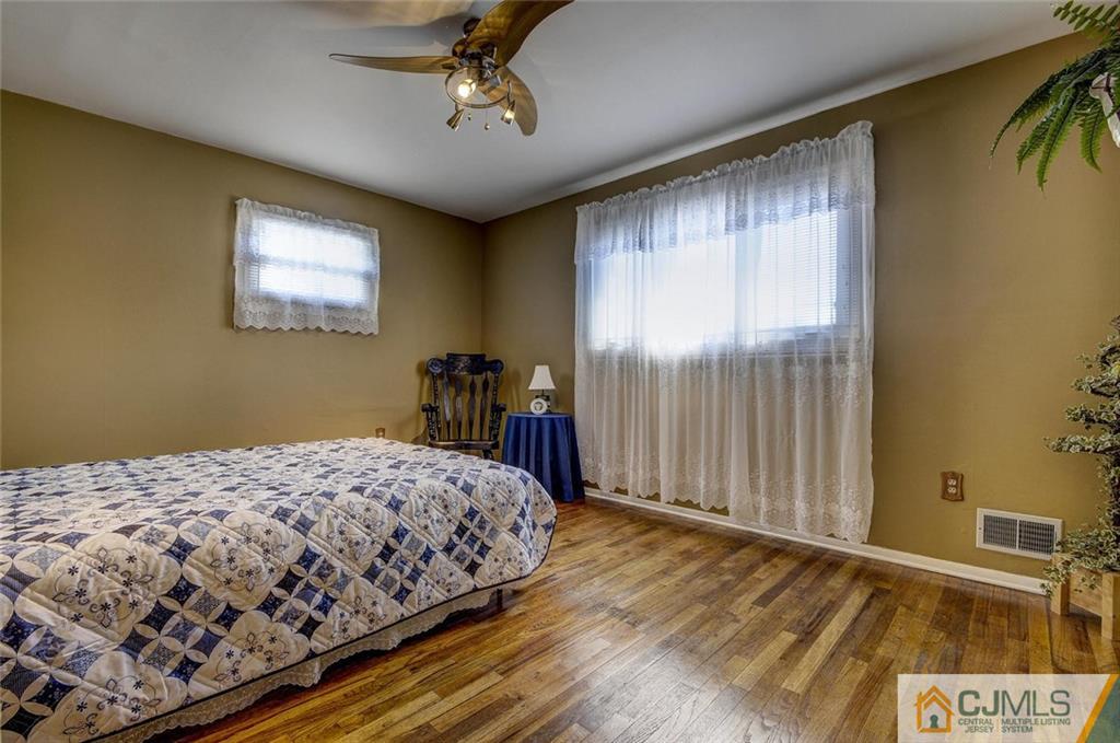 209 North Hill Road Colonia, NJ 07067 - Photo 17 of 18 a bedroom with a bed and a window