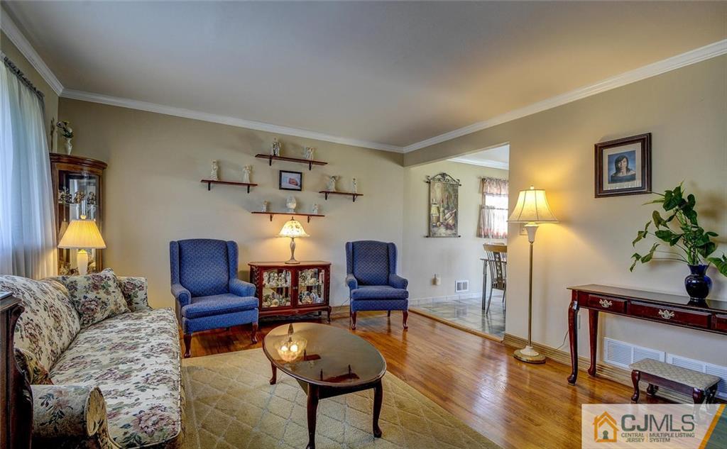 209 North Hill Road Colonia, NJ 07067 - Photo 4 of 18 a living room with furniture and wooden floor