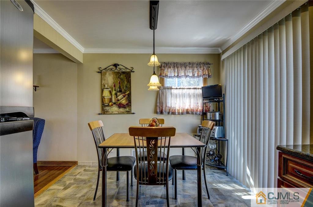 209 North Hill Road Colonia, NJ 07067 - Photo 10 of 18 a dining room with furniture and window
