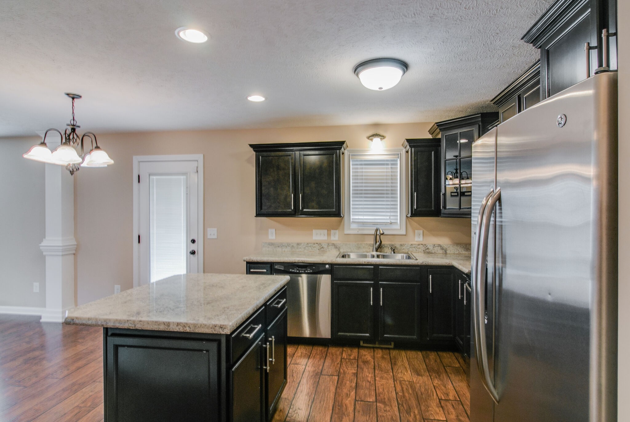 3744 Suiter Road Clarksville, TN 37040 - Photo 11 of 26 a kitchen with a sink and refrigerator
