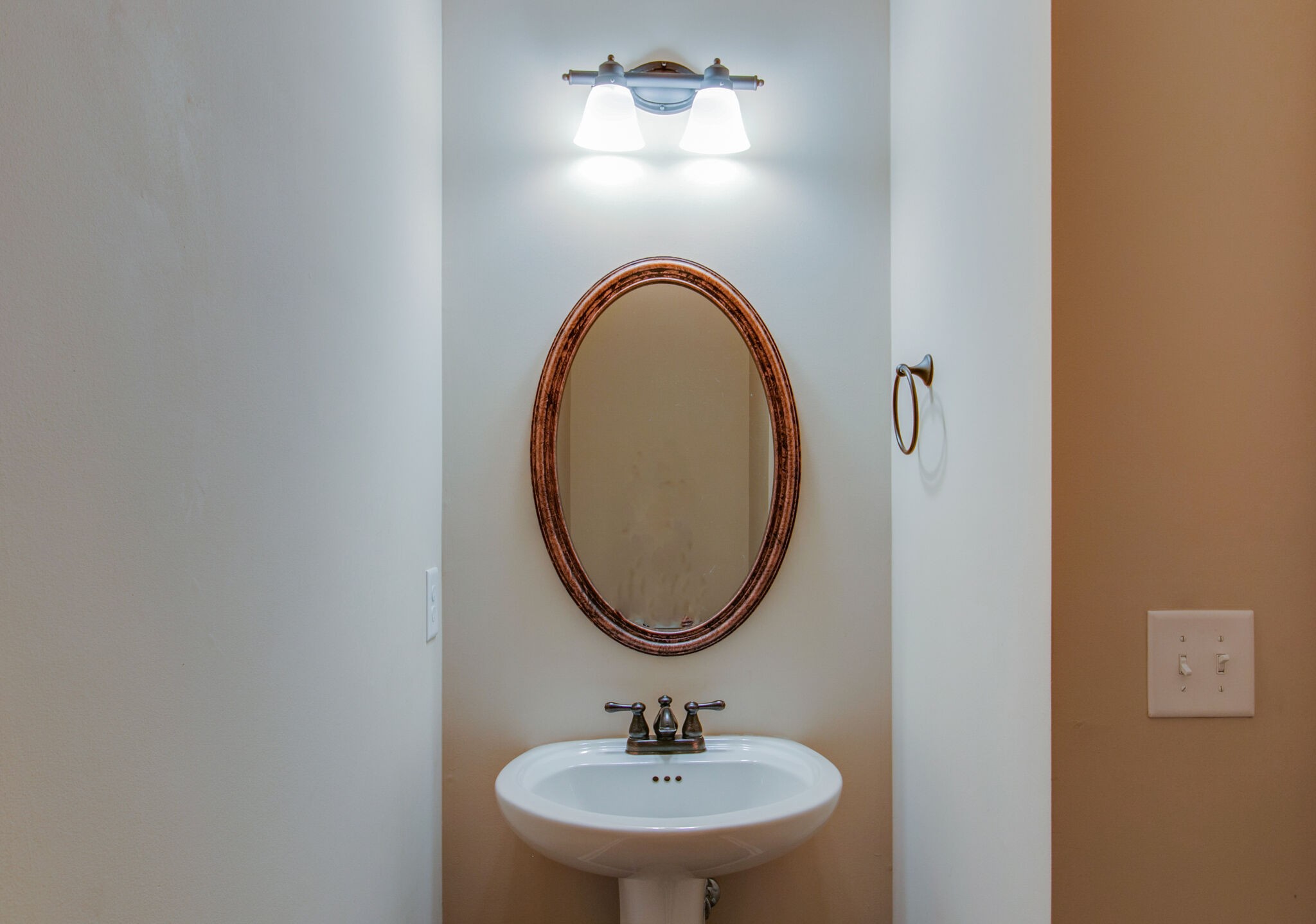 3744 Suiter Road Clarksville, TN 37040 - Photo 13 of 26 a bathroom with a sink and a mirror