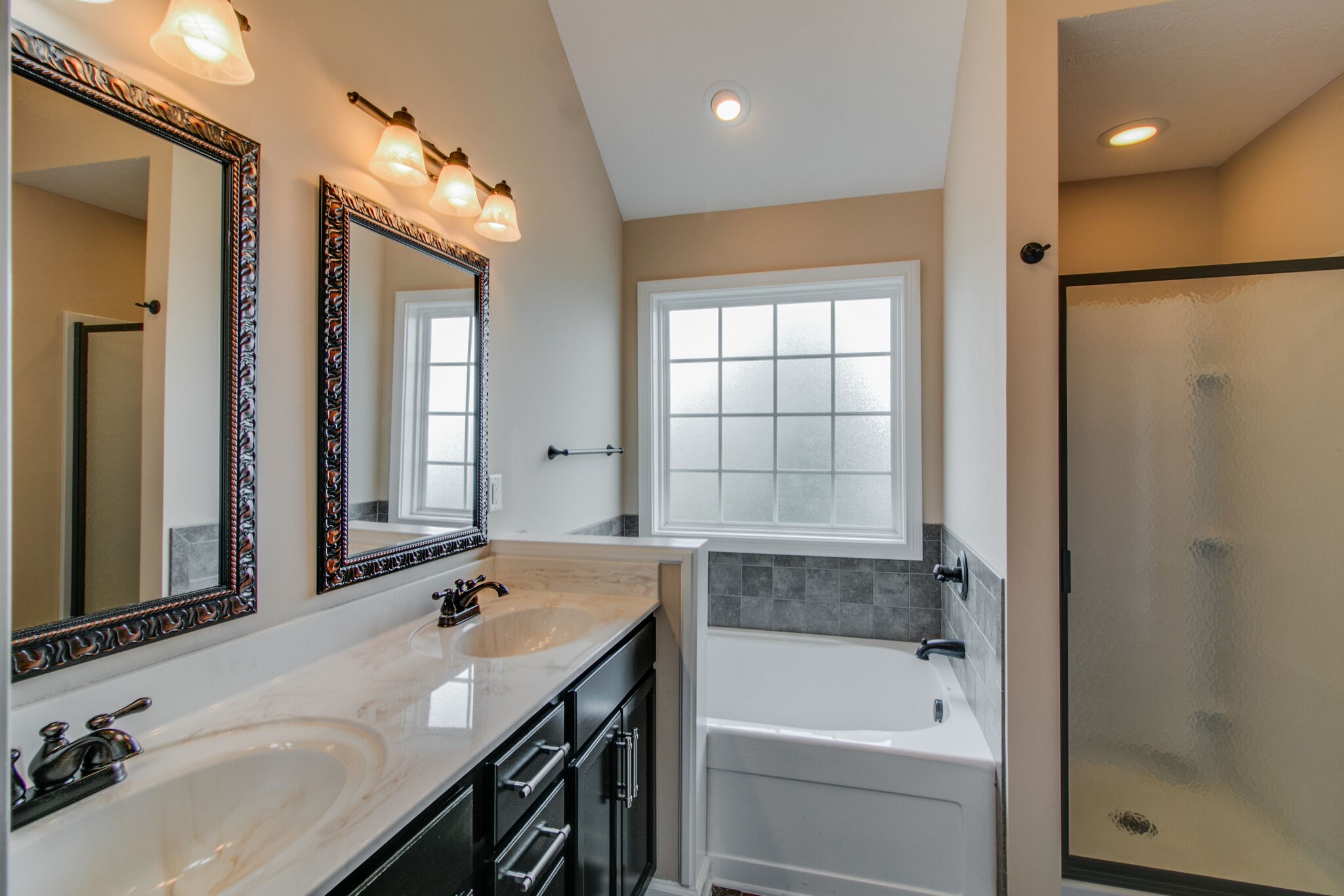 3744 Suiter Road Clarksville, TN 37040 - Photo 18 of 26 a bathroom with a tub sink and mirror