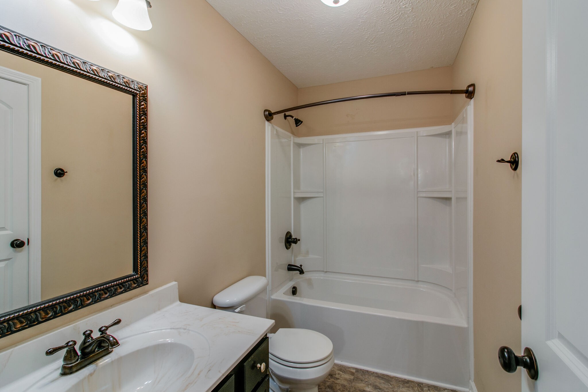 3744 Suiter Road Clarksville, TN 37040 - Photo 21 of 26 a bathroom with a sink toilet and shower