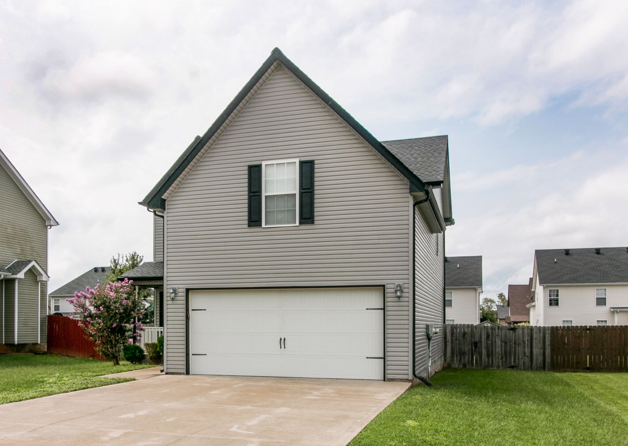 3744 Suiter Road Clarksville, TN 37040 - Photo 3 of 26 a view of a house with a yard and garage