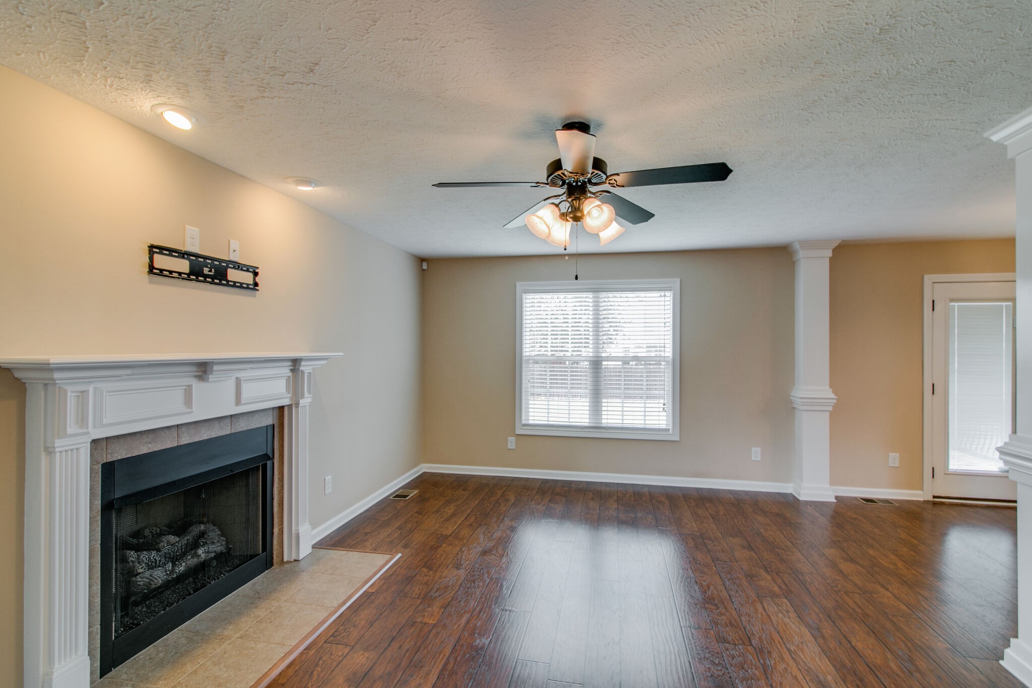 3744 Suiter Road Clarksville, TN 37040 - Photo 8 of 26 a view of an empty room with wooden floor and a window