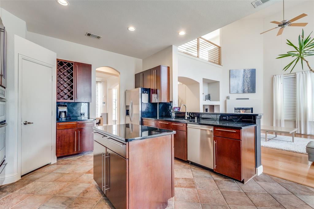 3313 Madison Avenue Hurst, TX 76054 - Photo 16 of 36 Kitchen with a kitchen island, includes stainless refrigerator.