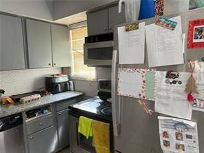 3231 Abbeywood Drive Decatur, GA 30034 - Photo 2 of 5 a kitchen with granite countertop a sink stove and cabinets